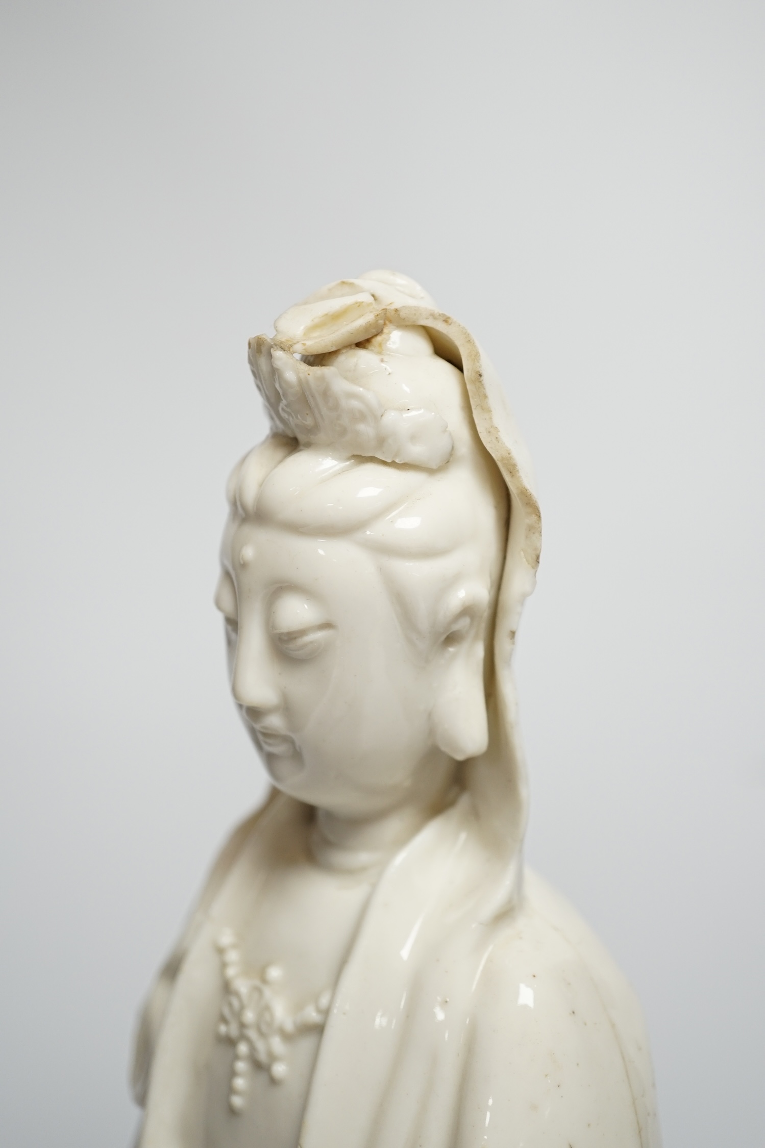 An 18th century Chinese blanc de chine figure of Guanyin, 42cm